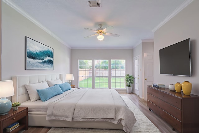 4226 Roaring Rapids Dr, Houston, TX 77059 - bedroom with ornamental molding, wood finished floors, and ceiling fan