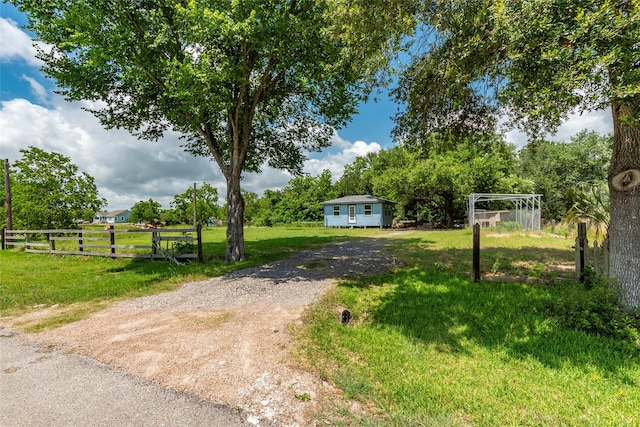 7230 Moore St, Hitchcock, TX 77563 - view of yard featuring driveway