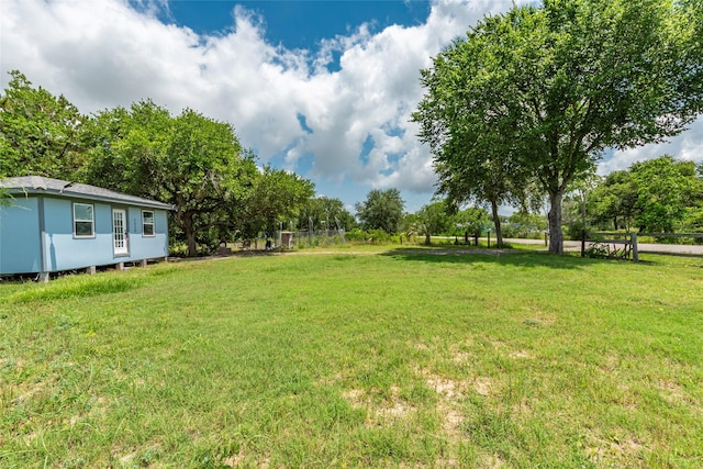 7230 Moore St, Hitchcock, TX 77563 - view of grassy yard featuring view of wooded area