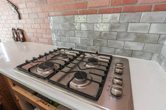 7230 Moore St, Hitchcock, TX 77563 - kitchen view of stainless steel gas stovetop and backsplash