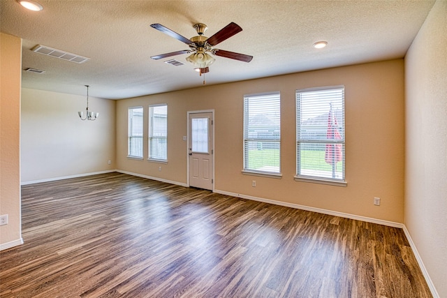 13230 Montane Manor Ln, Houston, TX 77044 - unfurnished room featuring dark wood-type flooring, a chandelier, a ceiling fan, and a textured ceiling