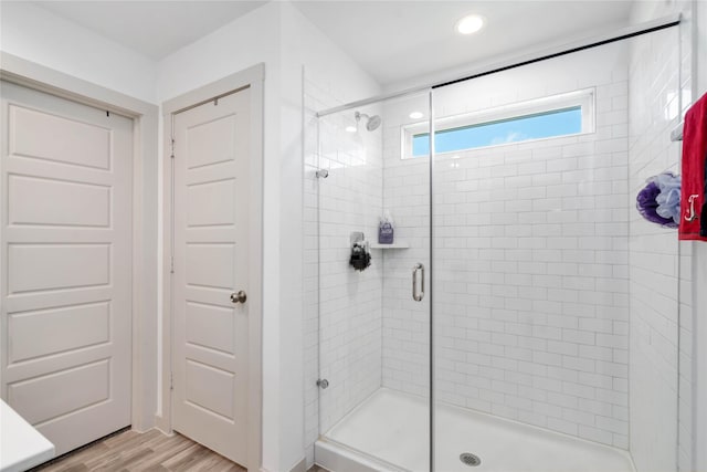 7730 Robert Ln, Rosharon, TX 77583 - bathroom featuring a stall shower, wood finished floors, and recessed lighting