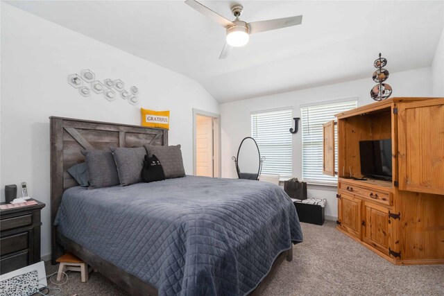 7730 Robert Ln, Rosharon, TX 77583 - bedroom with light colored carpet, vaulted ceiling, and ceiling fan