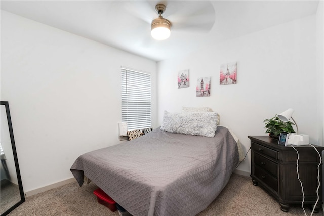 7730 Robert Ln, Rosharon, TX 77583 - bedroom featuring light colored carpet, a ceiling fan, and baseboards