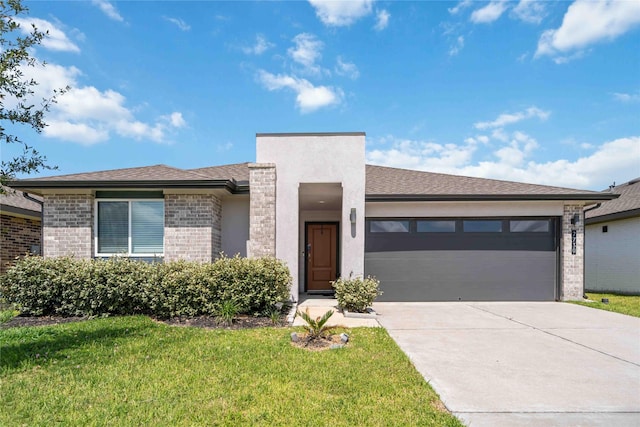 7730 Robert Ln, Rosharon, TX 77583 - view of front of house featuring an attached garage, driveway, and a front yard