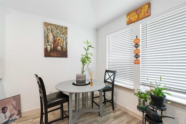 7730 Robert Ln, Rosharon, TX 77583 - dining area with light wood-style floors and baseboards