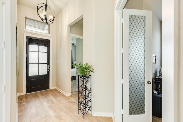 5007 Country Meadows Trl, Rosharon, TX 77583 - entrance foyer featuring a chandelier and baseboards