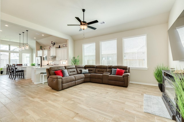 5007 Country Meadows Trl, Rosharon, TX 77583 - living area featuring light wood-type flooring, recessed lighting, a ceiling fan, baseboards, and vaulted ceiling