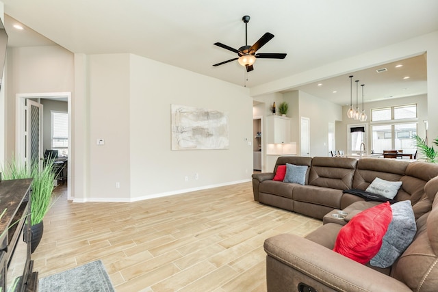 5007 Country Meadows Trl, Rosharon, TX 77583 - living room with ceiling fan, recessed lighting, baseboards, and light wood-type flooring