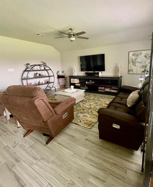 7638 Sirocco Ln, Baytown, TX 77523 - living area with a ceiling fan, vaulted ceiling, and wood tiled floors