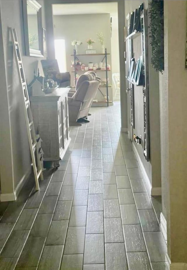 7638 Sirocco Ln, Baytown, TX 77523 - hallway featuring baseboards and tile patterned flooring