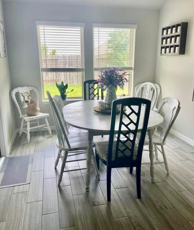 7638 Sirocco Ln, Baytown, TX 77523 - dining space with wood tiled floors and baseboards