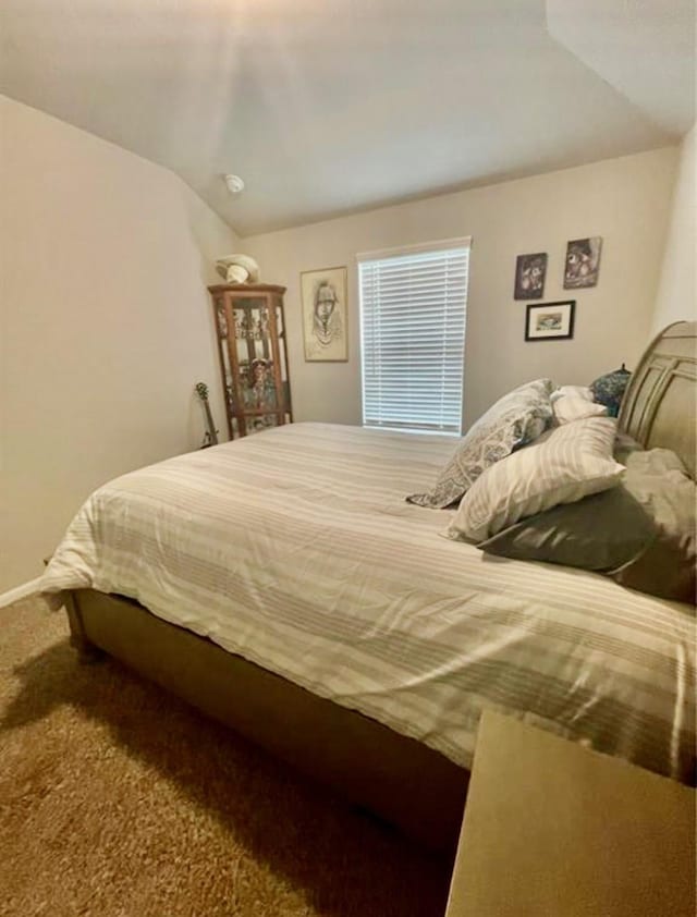 7638 Sirocco Ln, Baytown, TX 77523 - carpeted bedroom with lofted ceiling and baseboards