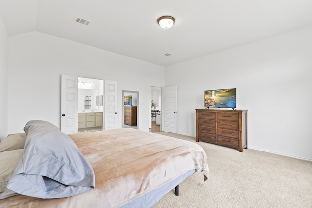 23014 Blackstone Park Rd, Katy, TX 77493 - bedroom with vaulted ceiling, light colored carpet, connected bathroom, and baseboards