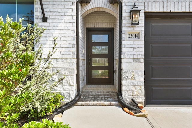 23014 Blackstone Park Rd, Katy, TX 77493 - property entrance featuring stone siding and an attached garage