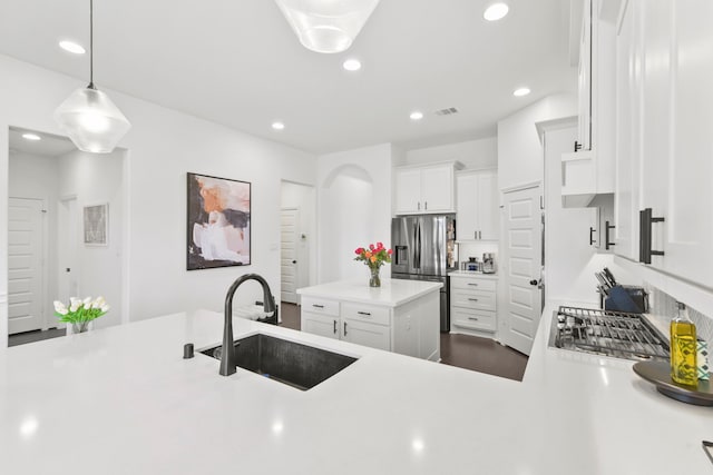 23014 Blackstone Park Rd, Katy, TX 77493 - kitchen featuring a sink, stainless steel fridge with ice dispenser, light countertops, white cabinets, and recessed lighting