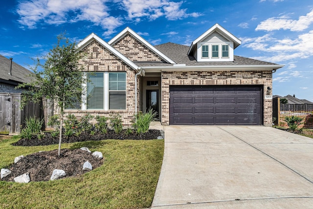 2410 Blazing Star Dr, Brookshire, TX 77423 - view of front of property featuring concrete driveway, brick siding, a garage, and roof with shingles