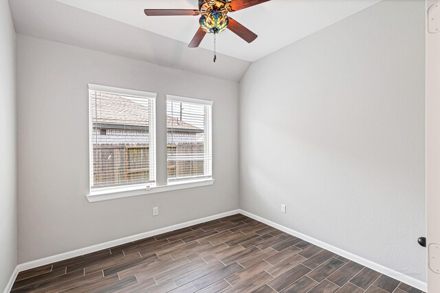 2410 Blazing Star Dr, Brookshire, TX 77423 - spare room with dark wood-style flooring, baseboards, a ceiling fan, and lofted ceiling