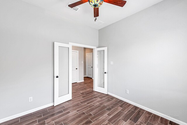 2410 Blazing Star Dr, Brookshire, TX 77423 - unfurnished bedroom with baseboards, dark wood-style flooring, french doors, and ceiling fan