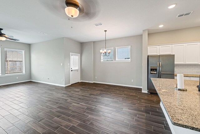 2410 Blazing Star Dr, Brookshire, TX 77423 - kitchen with stainless steel fridge with ice dispenser, ceiling fan, baseboards, open floor plan, and recessed lighting