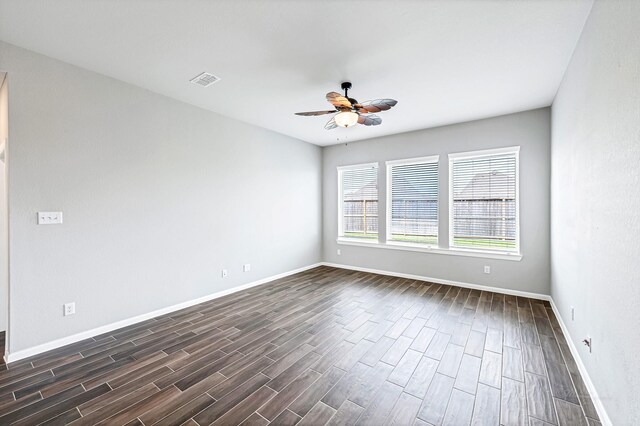 2410 Blazing Star Dr, Brookshire, TX 77423 - empty room featuring ceiling fan, dark wood-style flooring, and baseboards