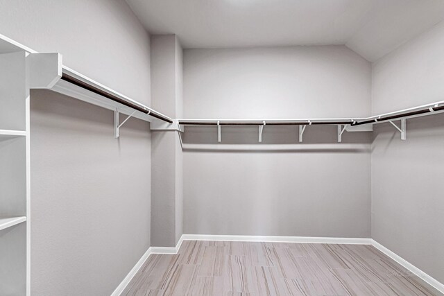 2410 Blazing Star Dr, Brookshire, TX 77423 - walk in closet with wood finished floors