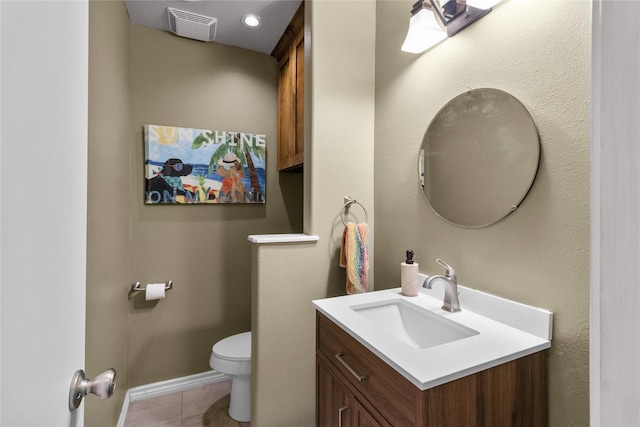 5525 Ibis Dr, Galveston, TX 77551 - half bath featuring vanity, toilet, and tile patterned floors