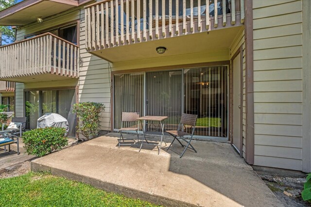 12900 Walden Rd Unit 415D, Montgomery, TX 77356 - view of patio with a balcony and grilling area