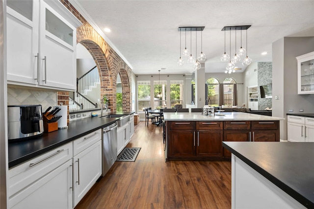 259 W Thorn Way, Houston, TX 77015 - kitchen featuring dishwasher, dark wood-style flooring, backsplash, dark countertops, and recessed lighting