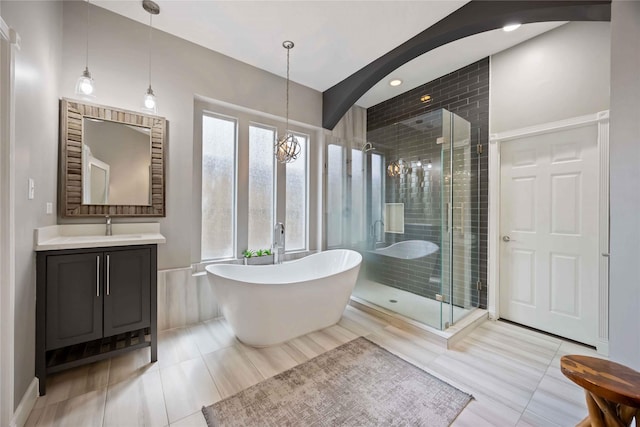 259 W Thorn Way, Houston, TX 77015 - bathroom with tile patterned flooring, a soaking tub, vanity, and a stall shower