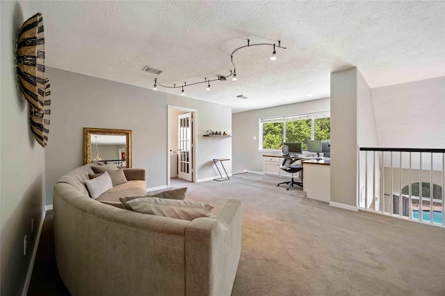 259 W Thorn Way, Houston, TX 77015 - living area with a desk, a textured ceiling, light colored carpet, baseboards, and track lighting
