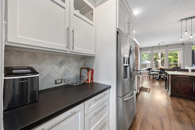 259 W Thorn Way, Houston, TX 77015 - kitchen featuring stainless steel refrigerator with ice dispenser, white cabinetry, tasteful backsplash, and decorative light fixtures