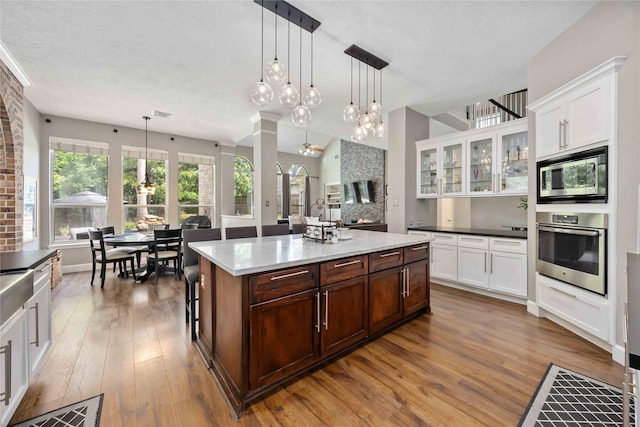 259 W Thorn Way, Houston, TX 77015 - kitchen featuring appliances with stainless steel finishes, wood finished floors, and white cabinets