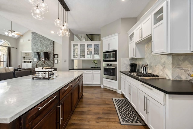 259 W Thorn Way, Houston, TX 77015 - kitchen featuring stainless steel appliances, tasteful backsplash, a ceiling fan, dark wood finished floors, and vaulted ceiling