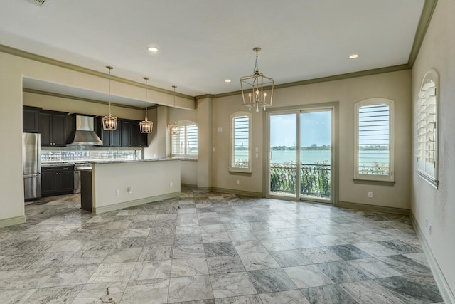 2466 Beacon Cir, League City, TX 77573 - kitchen with freestanding refrigerator, baseboards, a chandelier, wall chimney range hood, and crown molding