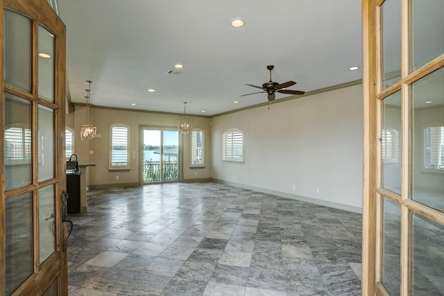 2466 Beacon Cir, League City, TX 77573 - empty room with a chandelier, baseboards, plenty of natural light, a ceiling fan, and ornamental molding