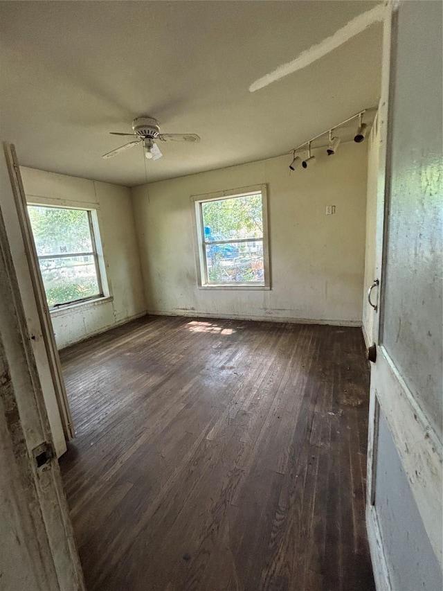 5317 Pease St, Houston, TX 77023 - empty room featuring dark wood-style flooring and ceiling fan