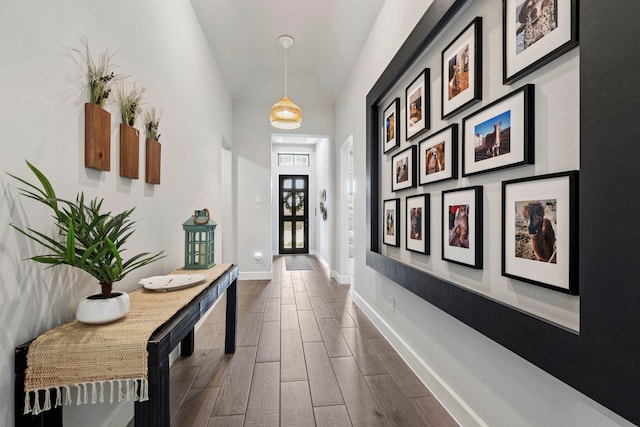 21514 Lost Valley Ln, Porter, TX 77365 - hall with dark wood-style floors, baseboards, and high vaulted ceiling