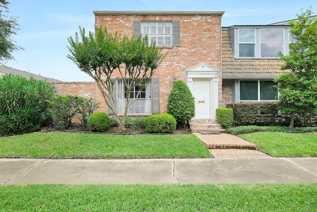 1321 Fountain View Dr Unit 131, Houston, TX 77057 - view of property with a front yard and brick siding