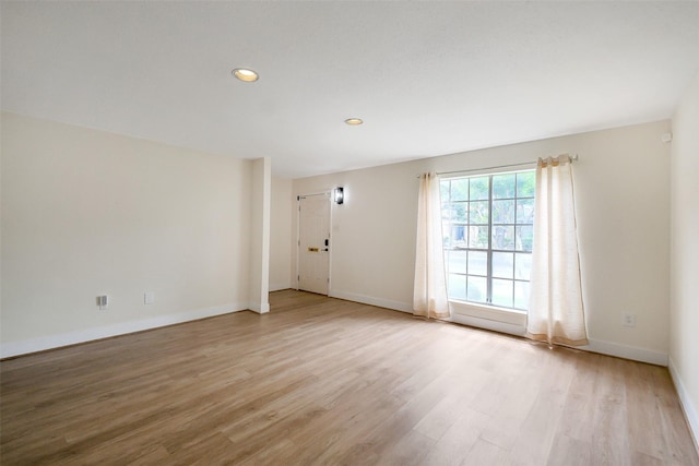 1321 Fountain View Dr Unit 131, Houston, TX 77057 - empty room featuring light wood-style flooring, baseboards, and recessed lighting