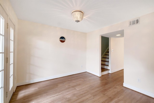 1321 Fountain View Dr Unit 131, Houston, TX 77057 - unfurnished room featuring wood finished floors, baseboards, and stairs