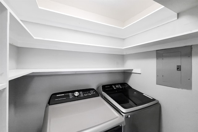 1321 Fountain View Dr Unit 131, Houston, TX 77057 - laundry room with electric panel and washing machine and clothes dryer