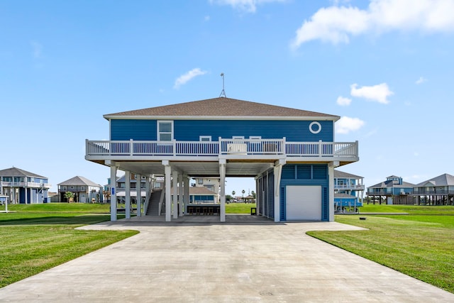 1816 Laguna Harbor Estate Blvd, Port Bolivar, TX 77650 - view of front of house featuring a carport, roof with shingles, driveway, and a front yard