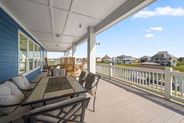 1816 Laguna Harbor Estate Blvd, Port Bolivar, TX 77650 - wooden deck with a residential view, outdoor dining space, and a water view