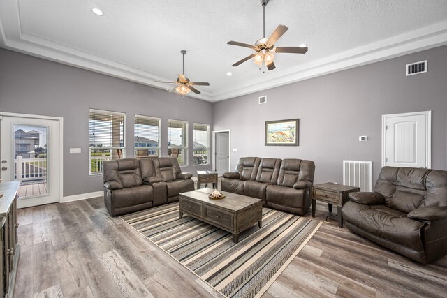 1816 Laguna Harbor Estate Blvd, Port Bolivar, TX 77650 - living room featuring a ceiling fan, wood finished floors, recessed lighting, baseboards, and a textured ceiling