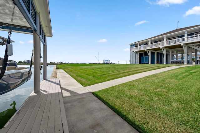 1816 Laguna Harbor Estate Blvd, Port Bolivar, TX 77650 - view of green lawn with a boat dock and a water view