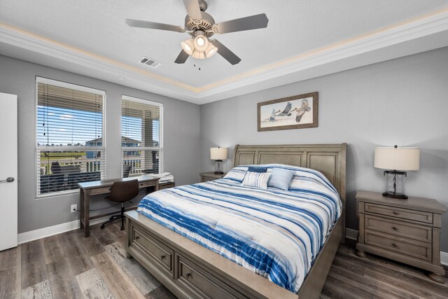 1816 Laguna Harbor Estate Blvd, Port Bolivar, TX 77650 - bedroom featuring wood finished floors, an office area, a tray ceiling, and baseboards