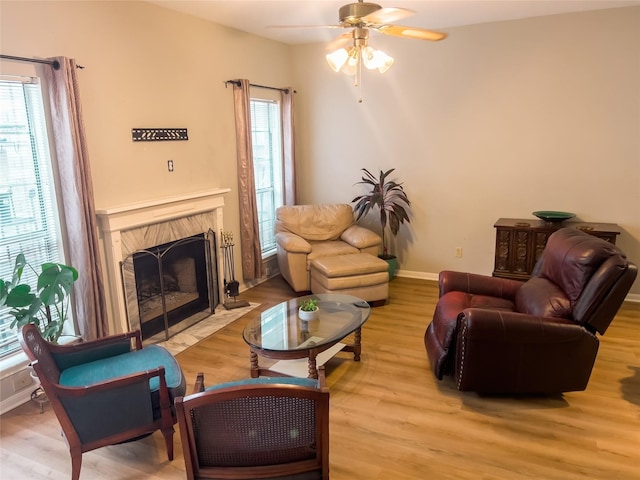 3212 Holly Hall St Unit 3212, Houston, TX 77054 - living room featuring light wood-style flooring, healthy amount of natural light, and a high end fireplace