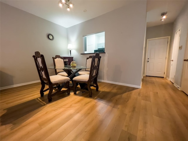 3212 Holly Hall St Unit 3212, Houston, TX 77054 - dining space with wood finished floors and baseboards