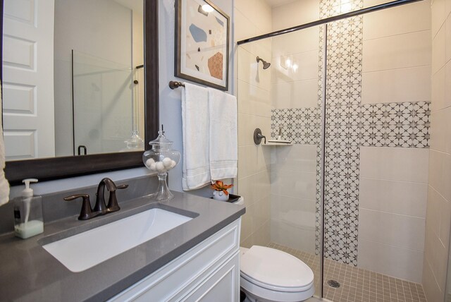 10914 Brambling Wood Dr S, Houston, TX 77043 - full bathroom with a shower stall, vanity, and toilet